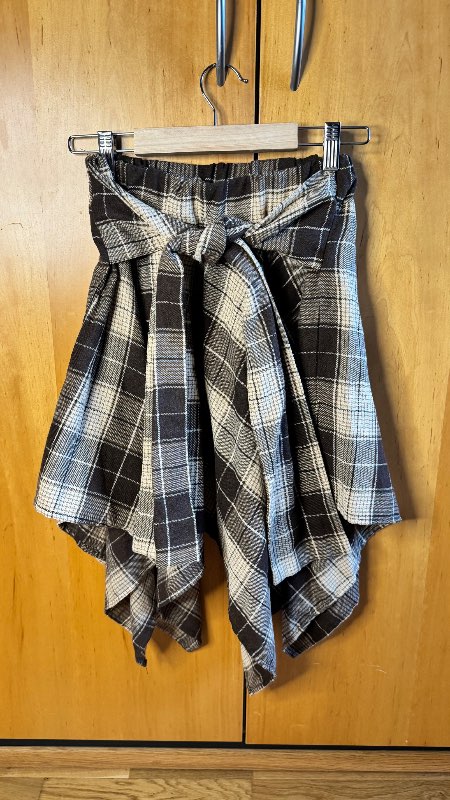 Plaid asymmetric skirt with tie belt
