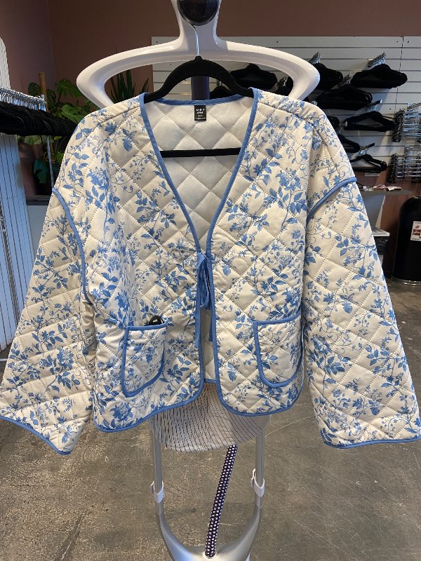 white and blue quilted jacket