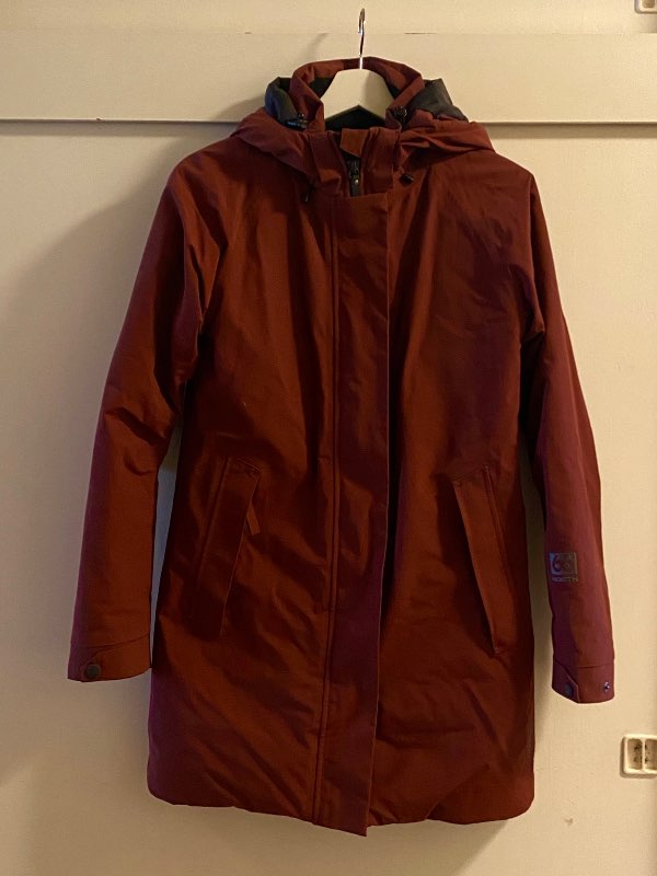 66 North red raincoat