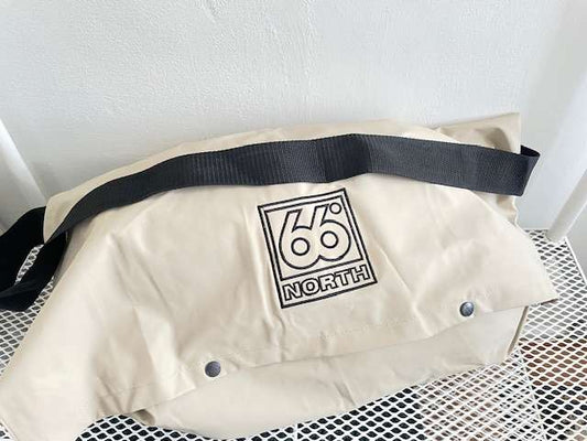 66 North beige bag