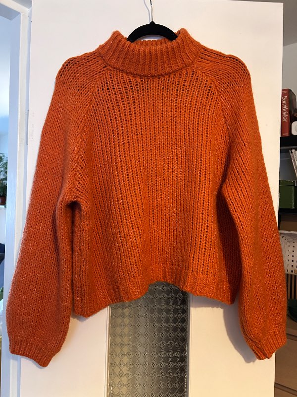 Orange knitted sweater