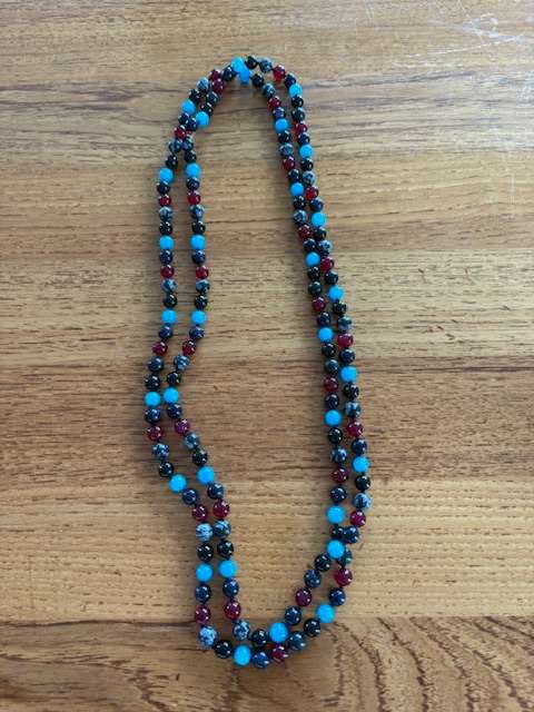 Perluhálsfesti mislit